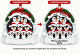 Personalized Resin Penguin Family of 9 Igloo Christmas Ornament, WS6309-9, supplied blank beside a personalized lettering example.
