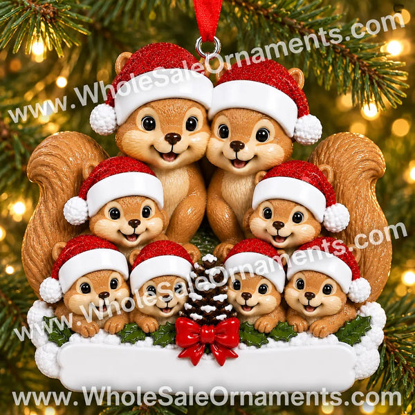 Squirrel family of eight Christmas ornament with pinecone, red bow and blank plaque, hanging on a Christmas tree with warm lights