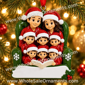 Family of 8 Reading in a Christmas Armchair Ornament with blank writing areas, hanging on a Christmas tree with warm golden lights