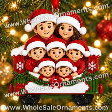 Family of 7 in a Red Christmas Train Car Ornament with blank writing areas, hanging on a Christmas tree with warm golden lights